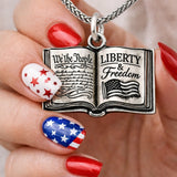 A school book with the constitution freedom peace necklace