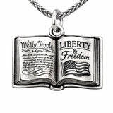 A school book with the constitution freedom peace necklace