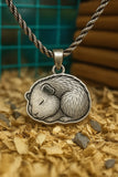 Curled up sleeping guinea pig necklace
